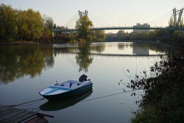 Arad, Arad Romania December 3 2021: Bridge over the river Mures and small boat