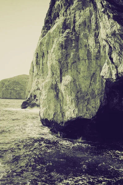 老式的棕褐色海王星石窟 — 图库照片