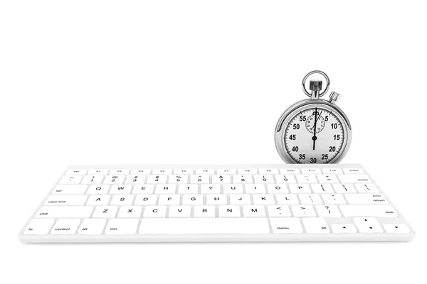 ストップウォッチで白いパソコンのキーボード — ストック写真