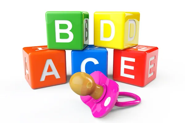 Alphabetical blocks and pacifier — Stock Photo, Image