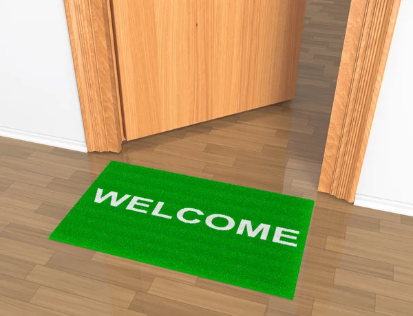 Opened door with welcome rug on the floor — Stock Photo, Image