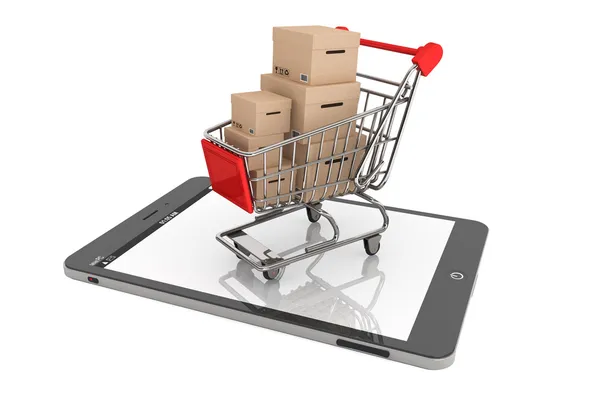 Carro de compras con cajas sobre Tablet PC — Foto de Stock