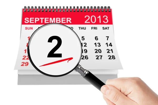 Concetto di Festa del Lavoro. Calendario 2 settembre 2013 con lente d'ingrandimento — Foto Stock