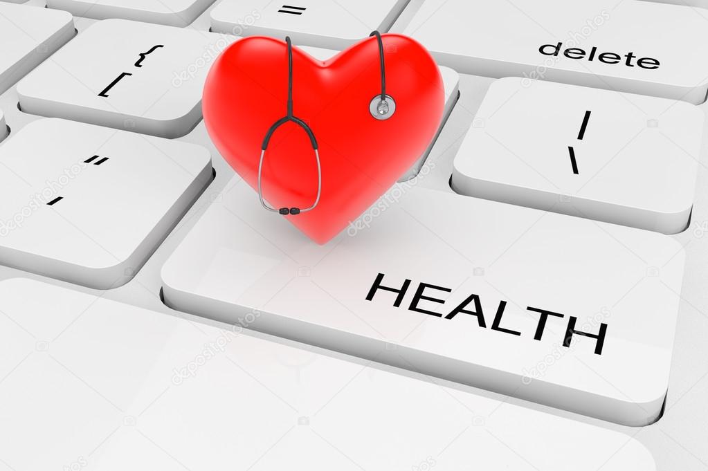 Red heart with stethoscope on a keyboard