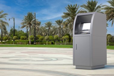 Business Technology Concept. ATM Deposit Machine on an Empty City Street with Palm Trees extreme closeup. 3d Rendering