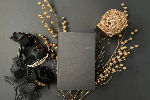 Black Magic black background with gold and blank book mock up