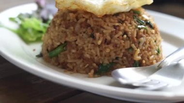 Close up Stir fried Minced pork with basil and fried egg and fish sauce dip background fast food Thai Style food. Thailand street food. Thailand's national dishes, Thai name is Pad kra prao Mou