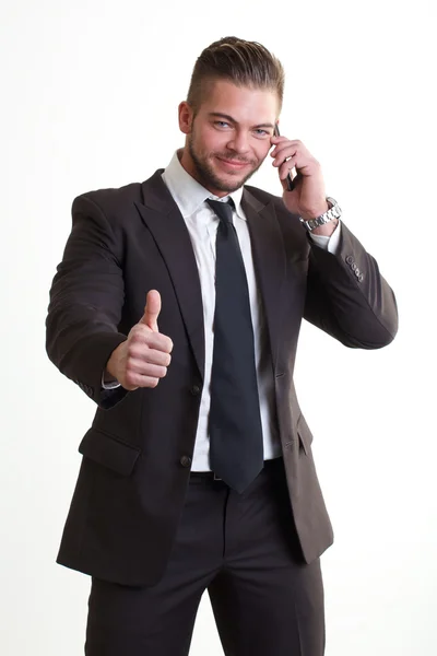 Бизнесмен разговаривает с мобильником — стоковое фото