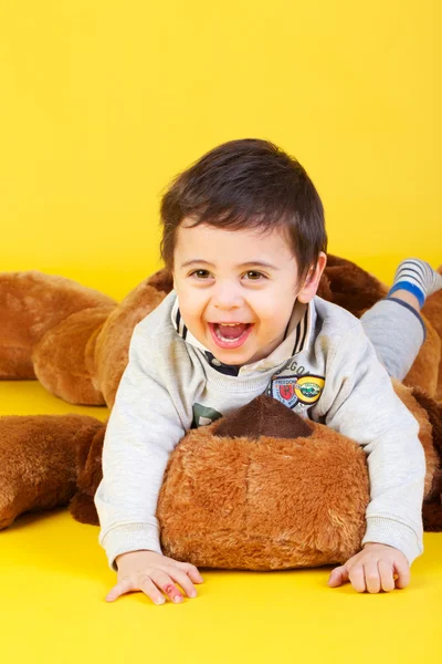 Little boy on yellow background — Stock Photo, Image