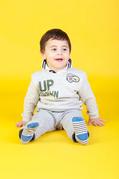 Little boy on yellow background — Stock Photo, Image