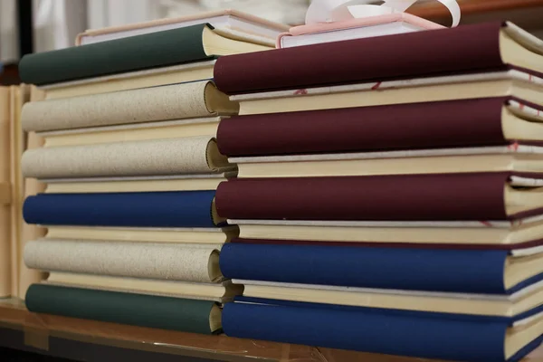 stack of books in a binding workshop