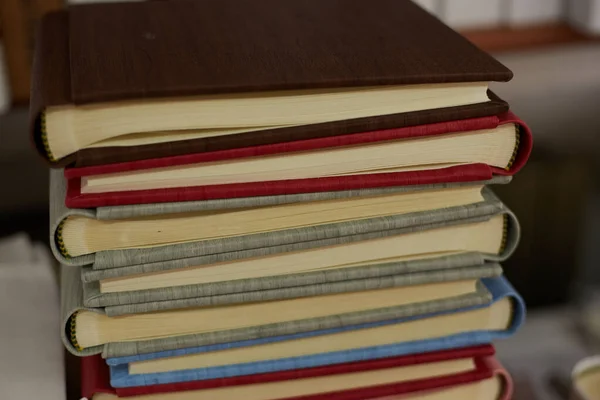 stack of books in a binding workshop