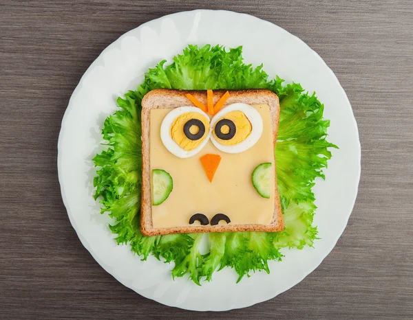 Design food. Creative sandwich for child with picture little ow — Stock Photo, Image
