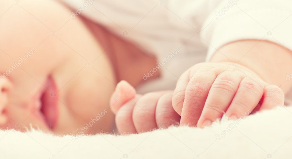 hand of sleeping baby newborn close up