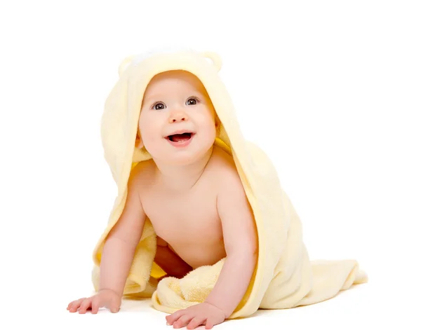 Happy beautiful baby in yellow towel isolated — Stock Photo, Image