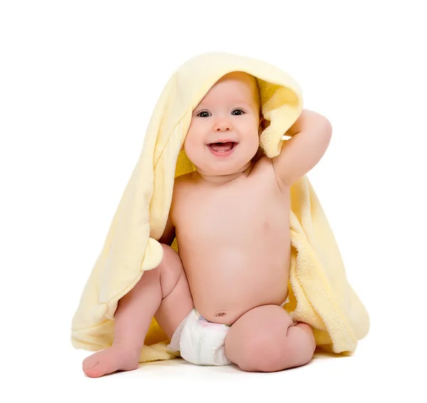 Happy beautiful baby in yellow towel isolated — Stock Photo, Image