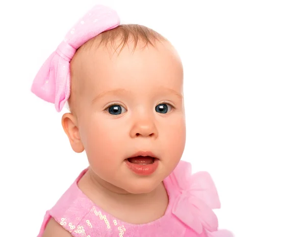 Face of a beautiful little baby girl with a pink bow isolated — Stock Photo, Image