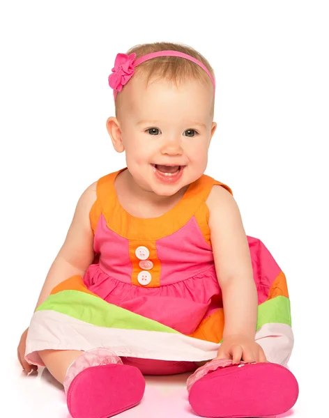 Happy little baby girl in bright multicolored festive dress isol — Stock Photo, Image