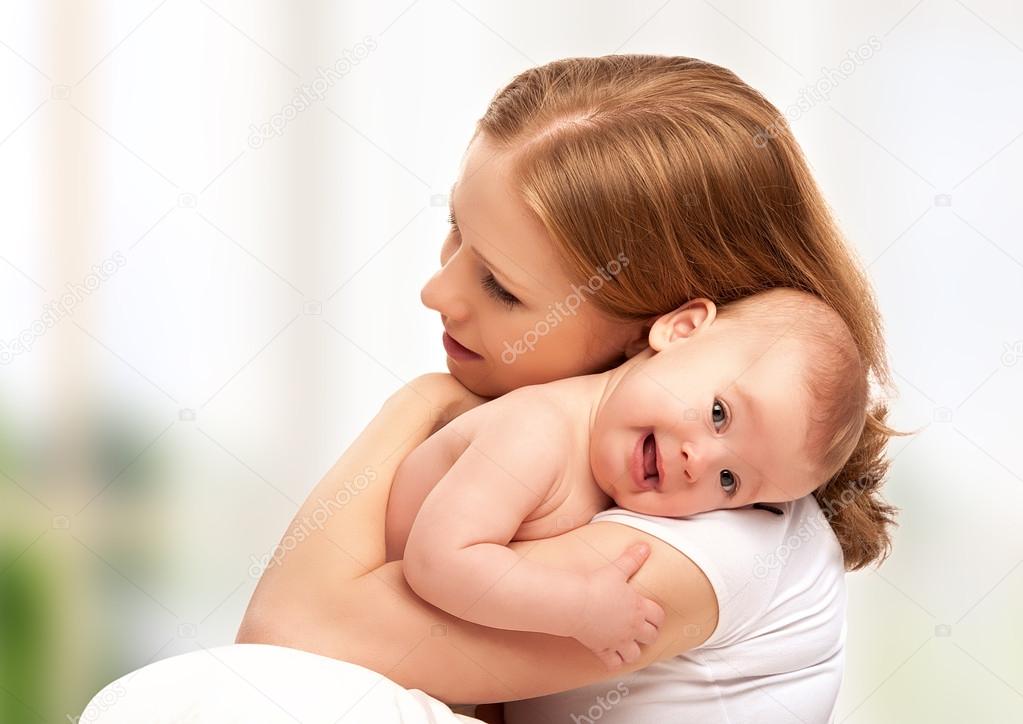 happy family. mother and baby hugging