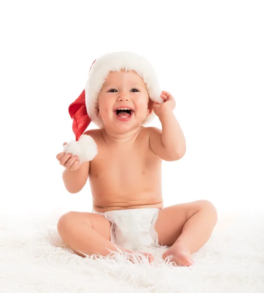 Bebê engraçado bonito em um chapéu de Natal isolado no branco — Fotografia de Stock