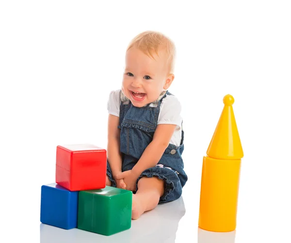 Happy cheerful child playing with blocks cubes isolated on white — Stock Photo, Image