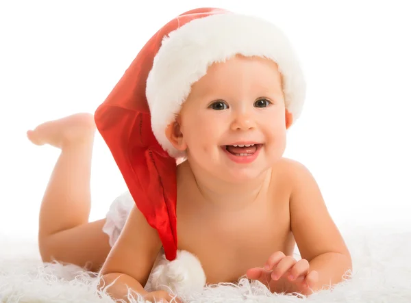 Bellissimo bambino divertente in un cappello di Natale isolato su bianco — Foto Stock