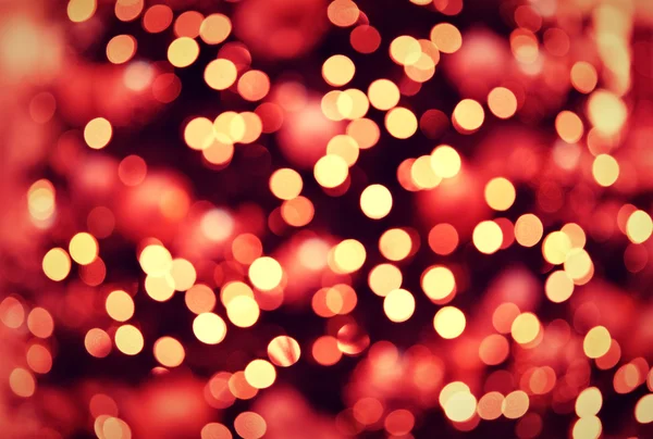 Vermelho dourado luzes de Natal fundo com bokeh — Fotografia de Stock
