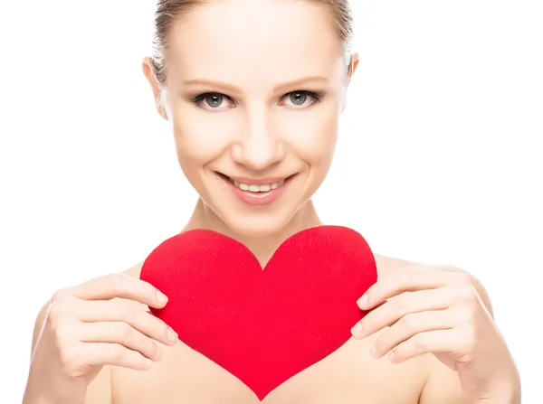Face of a beautiful young woman with red heart — Stock Photo, Image