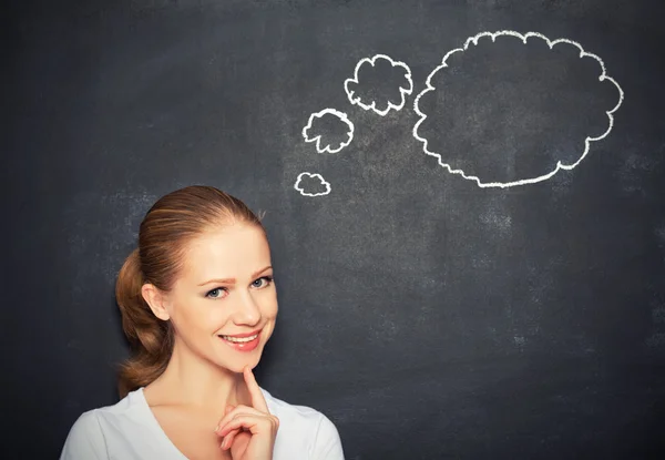 Woman think at blank blackboard — Stock Photo, Image