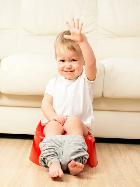 Baby sitting on potty in toilet — Stock Photo, Image