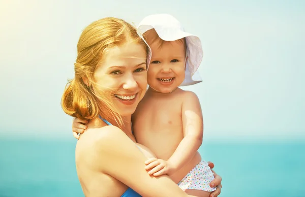 Happy family on the beach. mother and baby daughter — Stock Photo, Image