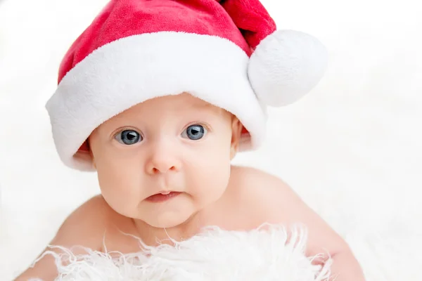 Cute newborn baby in christmas hat Royalty Free Stock Images
