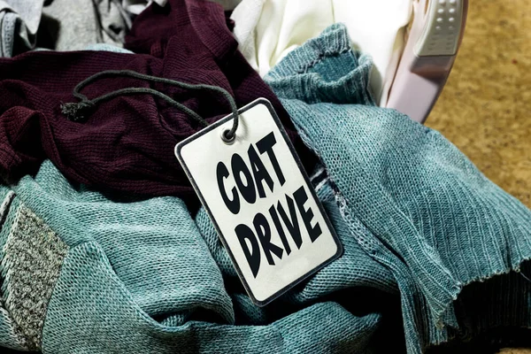 donation o coat drive concept, Clothes heap. there is a large pile of sketched clothes in basket