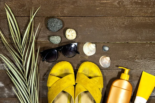 summer vacation , time to travel concept, wanderlust vacation background flat lay and sunglasses, slipper and sun cream on wood table