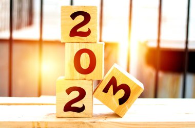 2023 new year greeting card template, 2023 on wooden cubes on wood table