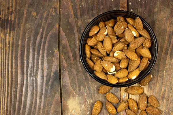 almond nuts peeled roasted in wooden bowl