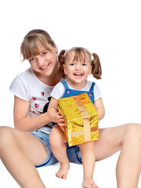 Merry sisters holding a gift — Stock Photo, Image