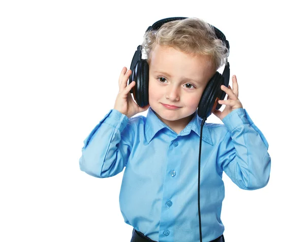 Menino alegre ouvindo música — Fotografia de Stock