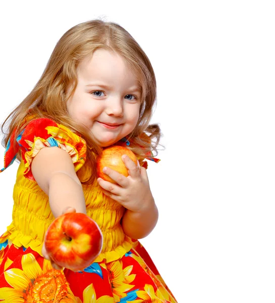 Little girl eating apples — Stock Photo, Image