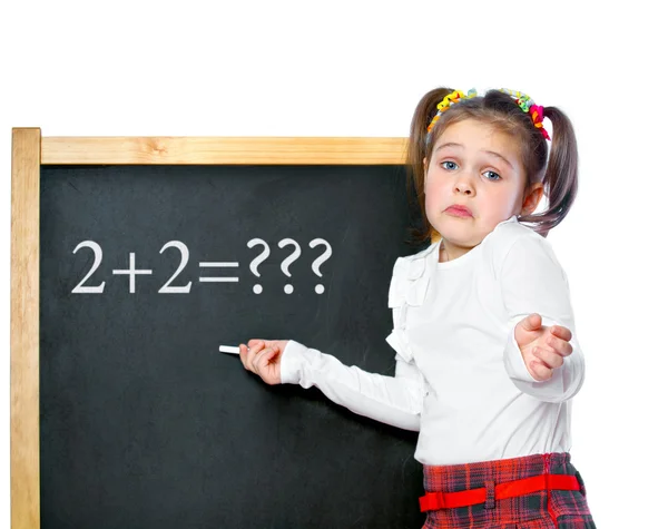 Girl standing at the blackboard, isolated — Stock Photo, Image