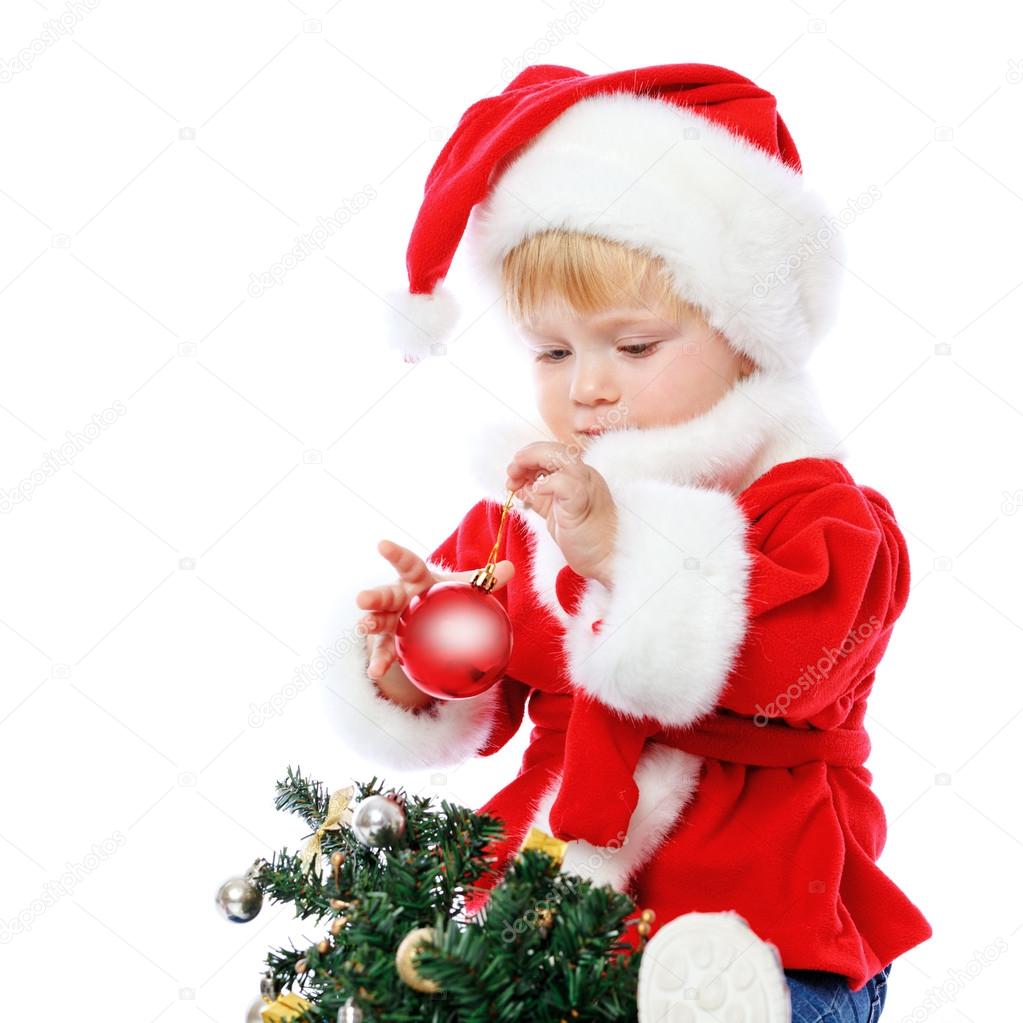 little girl dressed in Santa Claus