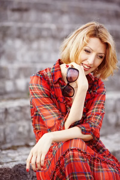 Beautiful girl in a red dress — Stock Photo, Image