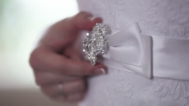 Beautiful bride adjusts her belt wedding dress — Stock Video