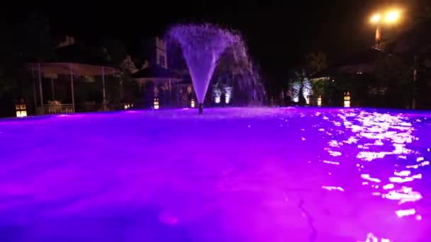 Colored lights at night pool — Stock Video