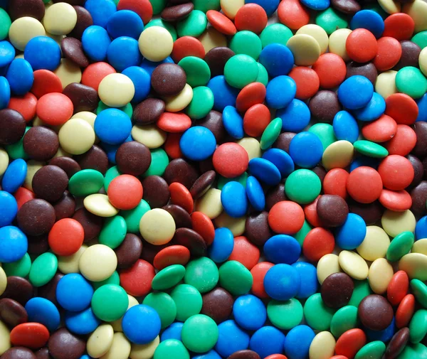 Un montón de caramelos multicolores de fondo — Foto de Stock