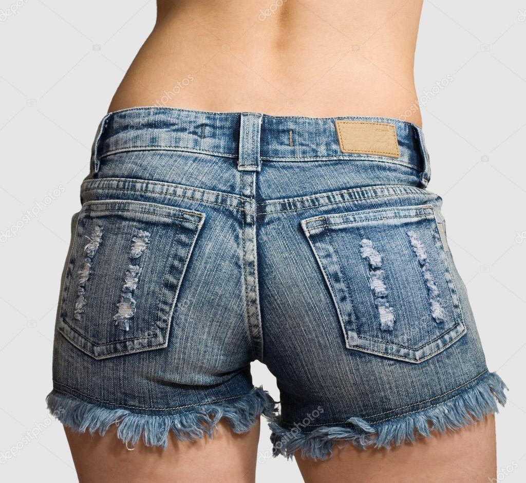 Hips of girl in blue short shorts