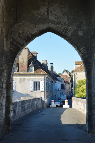 French town through the ancient stone arch — Stock Photo, Image