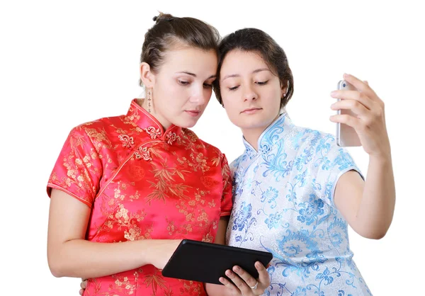 Young women with mobile devices — Stock Photo, Image