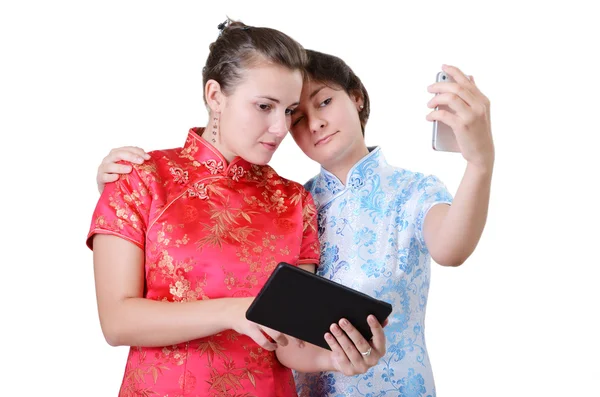 Young women with mobile devices — Stock Photo, Image