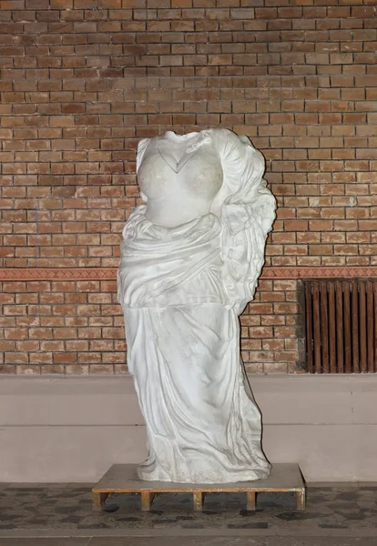 Headless female statue